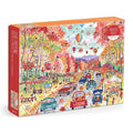 A 1000-piece jigsaw puzzle box titled 'Leaf-Peeping' by Galison featuring a colorful, busy autumn street scene with cars, people, hot air balloons, and fall foliage.