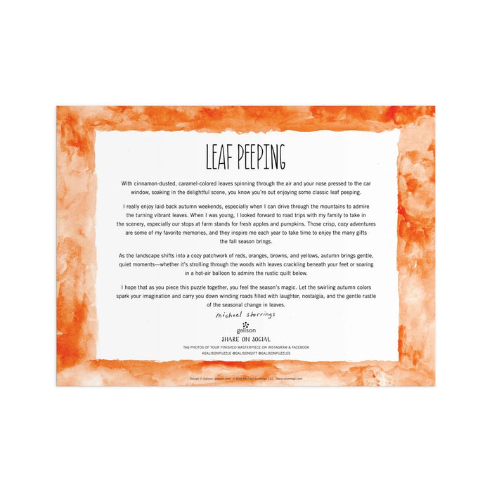A square printed card with a white center panel containing a description of the Leaf Peeping puzzle and a watercolor-style orange leaf pattern around the border, photographed against a plain white background.