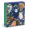 A 1000-piece jigsaw puzzle box titled 'Owls at Dawn' by Galison. The box features a colorful, detailed illustration of different colored owls in a forest setting with autumn leaves and foliage on a dark navy blue background. Front angle view shown on a white background.