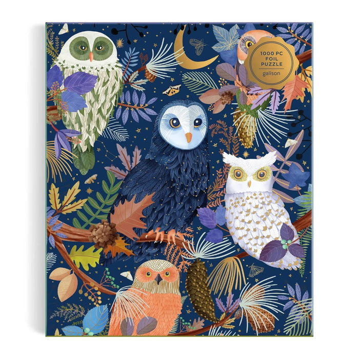 A 1000-piece jigsaw puzzle box titled 'Owls at Dawn' by Galison. The box features a colorful, detailed illustration of different colored owls in a forest setting with autumn leaves and foliage on a dark navy blue background. Front view shown on a white background.