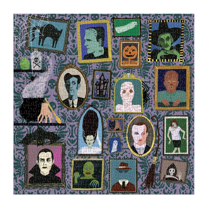 A square jigsaw puzzle featuring a Halloween collage design on a purple patterned background. The puzzle shows multiple framed portraits and illustrations of classic horror characters, including Frankenstein's monster, Dracula, the Bride, the Catwoman, a witch, a ghost, a pumpkin, and a skeleton, arranged across the surface.