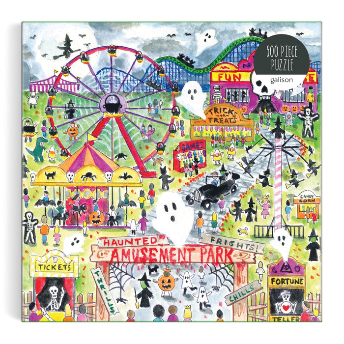 Puzzle box with a colorful illustration of a haunted amusement park, featuring a Ferris wheel, roller coaster, and various Halloween-themed elements.