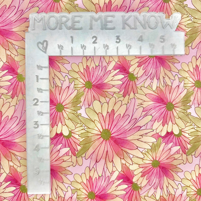 This printed WPCotton features daisy flowers in shades of pink, peach, and a hint of green.
