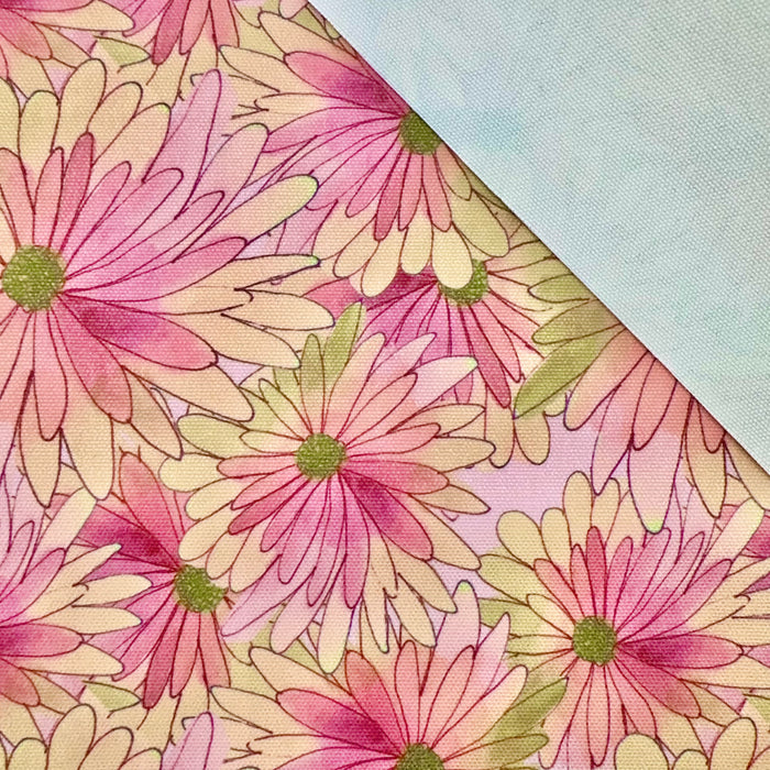 This printed WPCotton features daisy flowers in shades of pink, peach, and a hint of green.