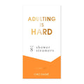 Product packaging for 'Adulting is Hard' shower steamers by Chez Gagne on a white background.