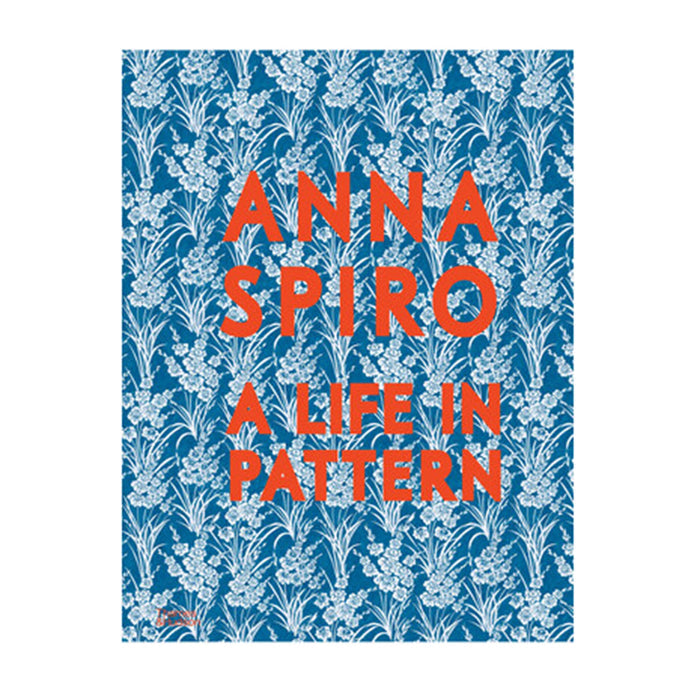 Book cover with floral pattern and 'Anna Spiro: A Life in Pattern' text on a blue background, on a white background.