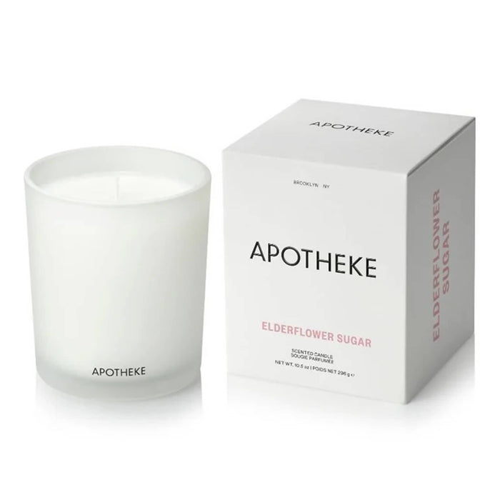 White Apotheke candle and packaging on a white background.
