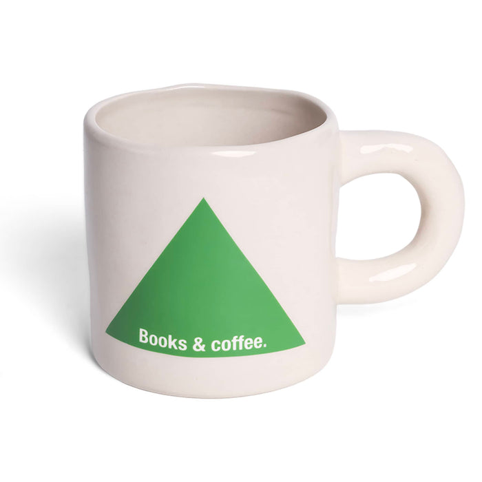 White mug with a green triangle and 'Books & coffee.' text on a white background.