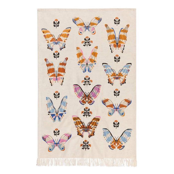 Beige tea towel with colorful butterfly pattern and fringes on a white background.