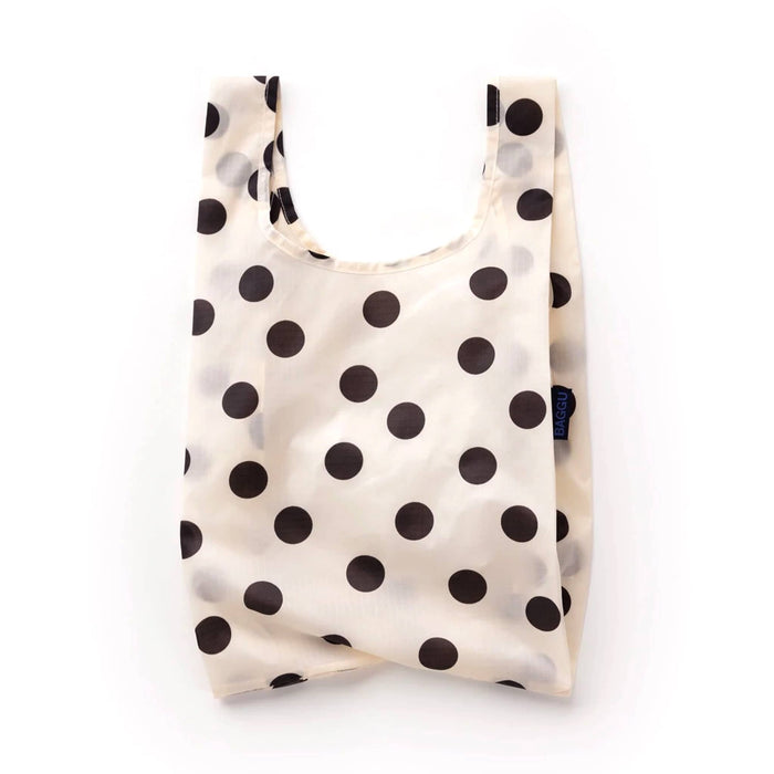 A reusable ripstop nylon shopping bag with a black polka dot pattern on a cream background, shown against a plain white studio background.