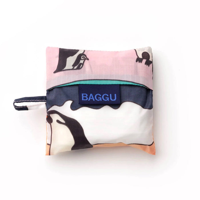 Baby Baggu reusable shopping bag with penguin design in matching pouch, on a white background.