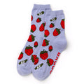 Light blue socks with red strawberry pattern on a white background.