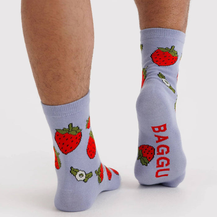 Light blue socks with strawberry pattern and 'BAGGU' branding on a white background.