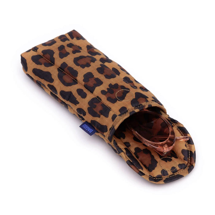 Leopard puffy recycled ripstop nylon glasses sleeve, with sunglasses, on a white background.