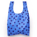 A reusable recycled ripstop nylon shopping bag in bright blue with a dark blue polka dot pattern, shown against a plain white background.