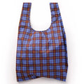 A reusable recycled ripstop nylon bag with a blue, red, and yellow tartan pattern, photographed against a plain white background.