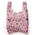 A reusable recycled ripstop nylon shopping bag in light pink with a dense multicolor floral and mythical creature pattern, shown against a plain white background.