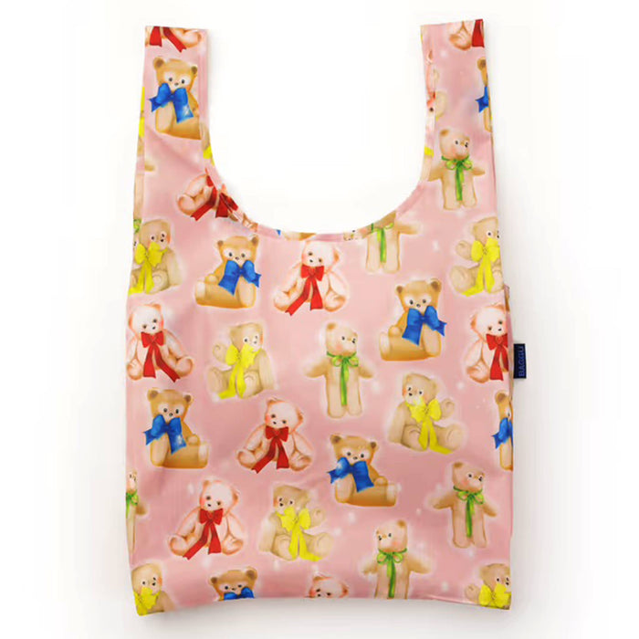 Reusable shopping bag with teddy bear pattern on a pink background.