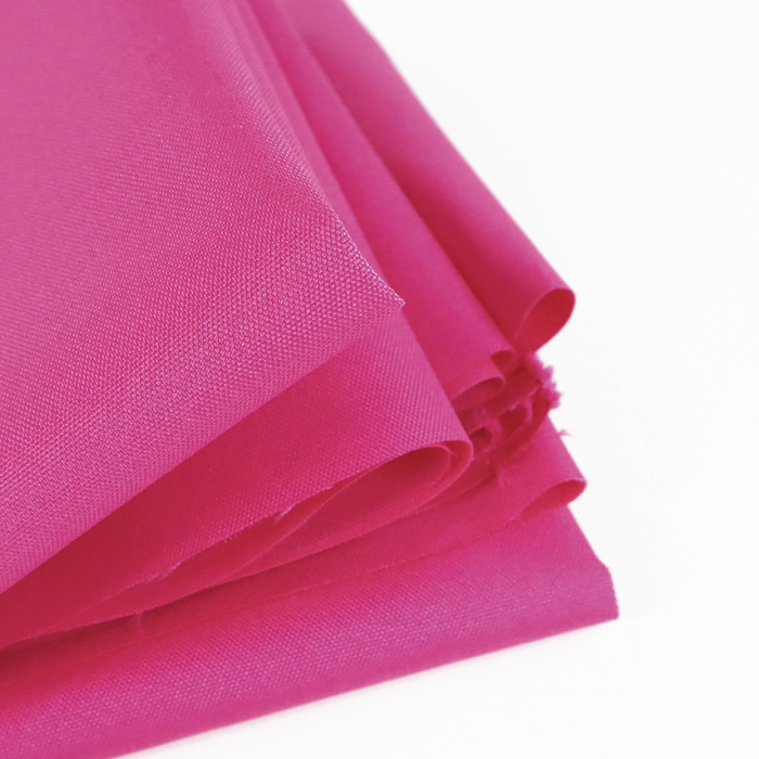 This WPC-Lite solid is in a bright pink with purple undertones. This photo shows the fabric folded.