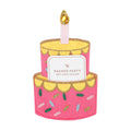 Pink cake-shaped felt gift card holder with a candle and 'Packed Party' card on a white background.