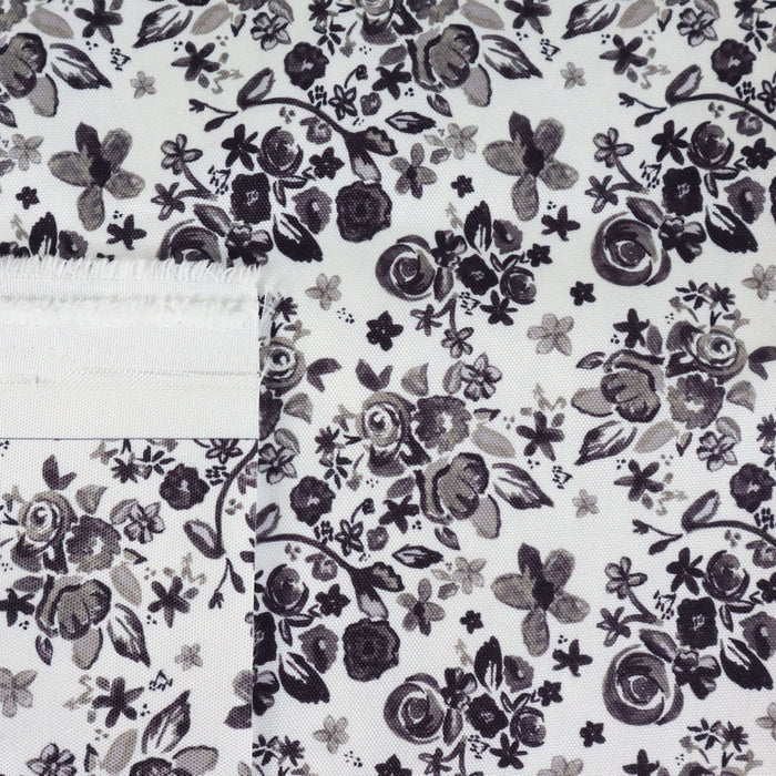 This printed WPC-Lite is of a variety of black flowers on a white background.