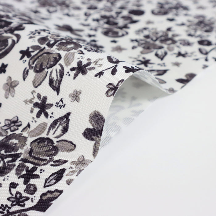 This printed WPC-Lite is of a variety of black flowers on a white background.