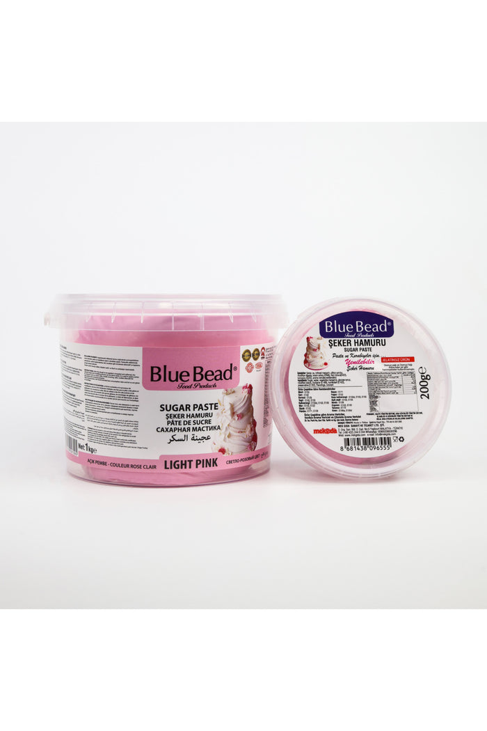 Blue Bead Sugar Paste Light Pink is a smooth, flexible fondant designed for cake decorating and creative baking projects.