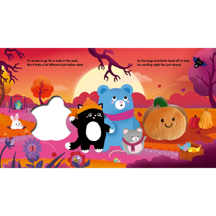 A children's board book or activity book spread featuring a colorful autumn park scene with illustrated animals including a black cat, blue bear, pumpkin, rabbit, and bird. The page has text at the top and a large white cutout shape on the left side, indicating an interactive or folding-book element.