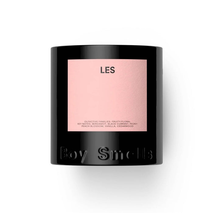 LES scented Boy Smells candle in matte black glass vessel with matte pink label, front view, on a white background.