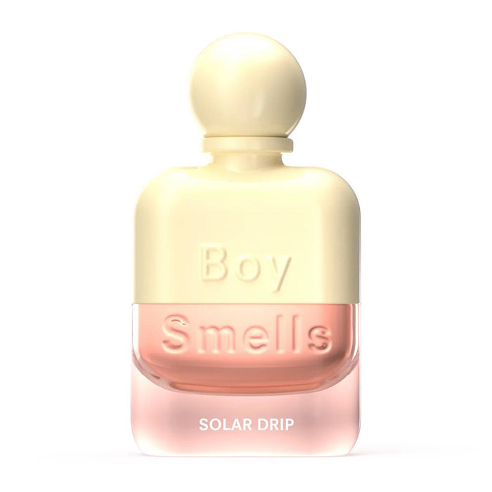 Yellow and pink perfume bottle labeled 'Boy Smells Solar Drip' on a white background.