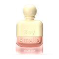 Yellow and pink perfume bottle labeled 'Boy Smells Solar Drip' on a white background.
