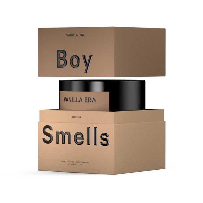 Boy Smells Vanilla Era scented 9 ounce Classics candle in black glass vessel with brown label in open box.