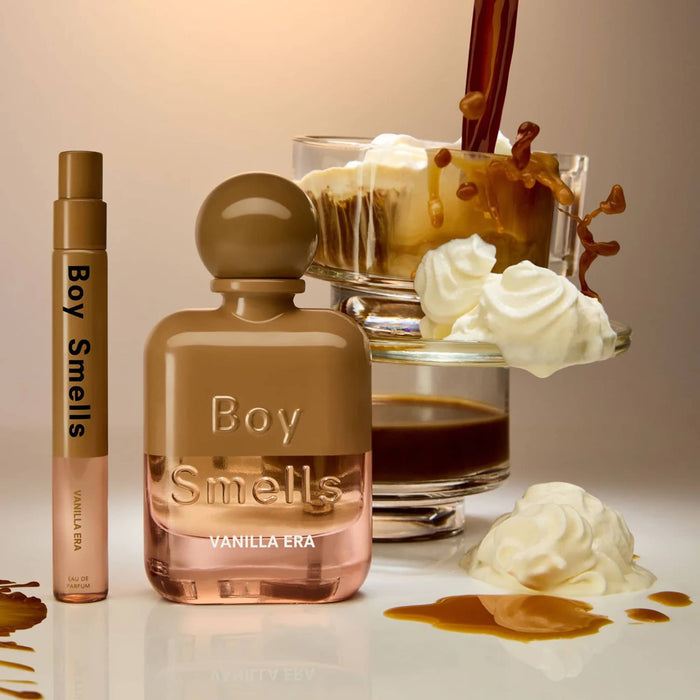 Boy Smells Vanilla Era scented eau de parfum 10ml travel spray bottle and 50ml bottle, with espresso and whipped cream in the background.