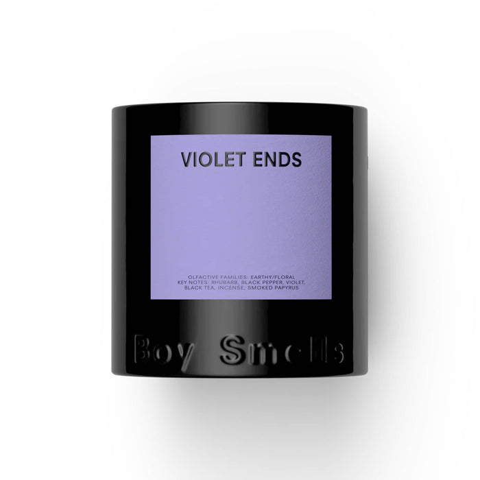 Boy Smells Violet Ends scented 9 ounce Classics candle in black glass vessel with dark violet label, front view.