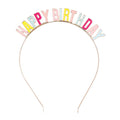 Colorful 'Happy Birthday' headband on a white background.