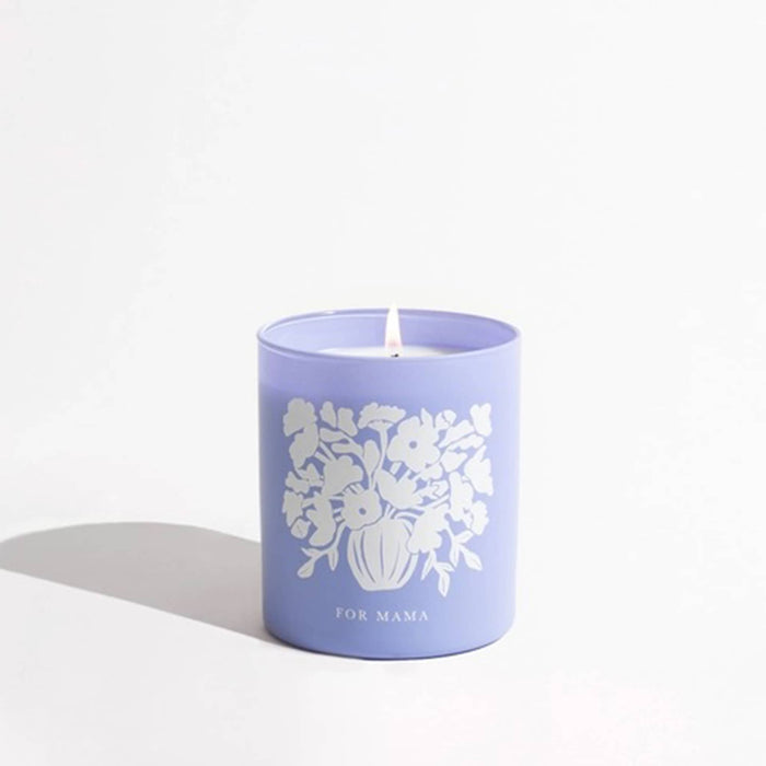 Brooklyn Candle Studio Flowers for Mama scented candle in a periwinkle vessel with a floral bouquet illustration, on a white background.