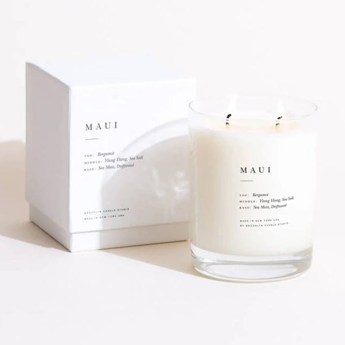MAUI scented double wick candle and packaging on a white background.