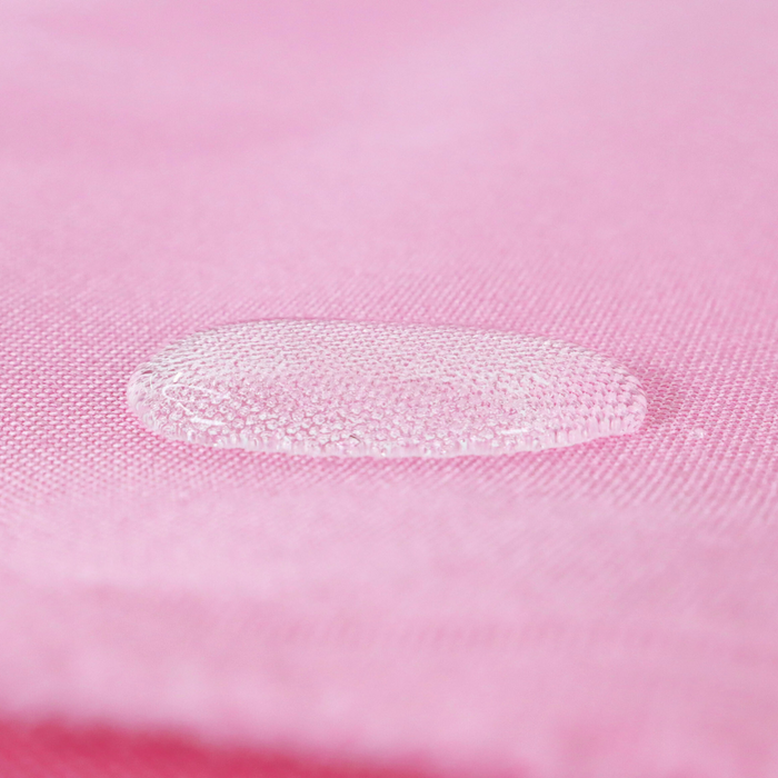 This WPC-Lite solid is in a bright cool toned pink. This photo shows a water drop on the fabric.