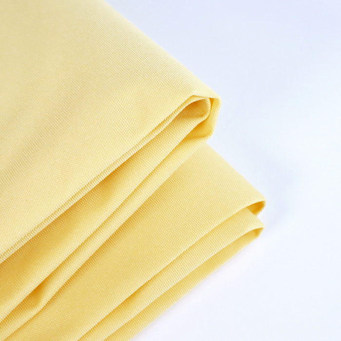 This ReNew Solid is a soft shade of yellow. This photo is of the fabric folded.