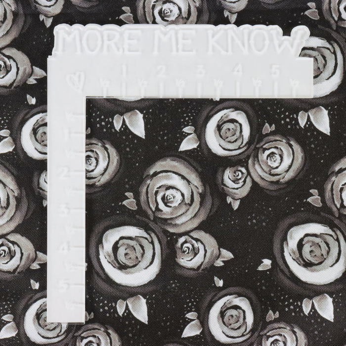 This printed WPC-Lite is of watercolor roses in black and white. This photo shows a white ruler for scale.