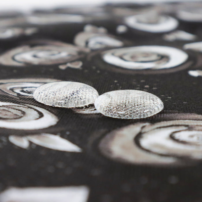 This printed WPC-Lite is of watercolor roses in black and white. This photo shows 2 water droplets on the fabric.