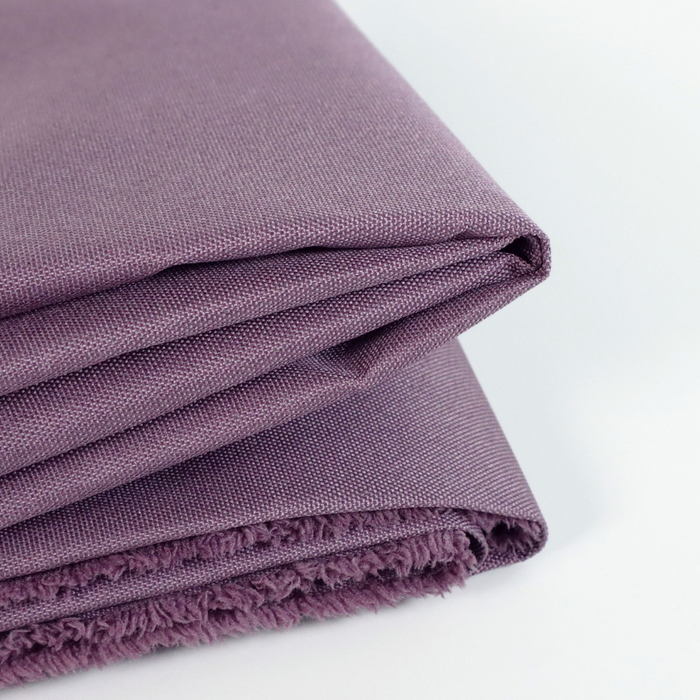 This WPC-Lite solid is a very muted purple with red undertones. This photo shows the fabric folded.