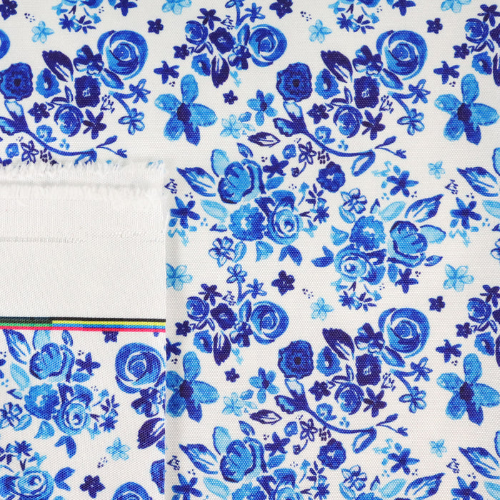 This printed WPC-Lite is of a variety of blue flowers on a white background.