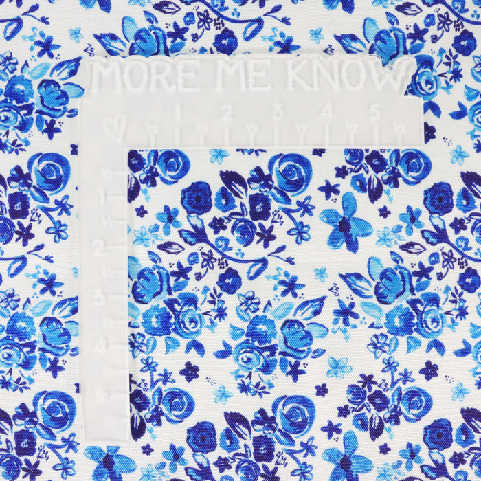 This printed WPC-Lite is of a variety of blue flowers on a white background. This photo shows a white L shaped ruler for scale.