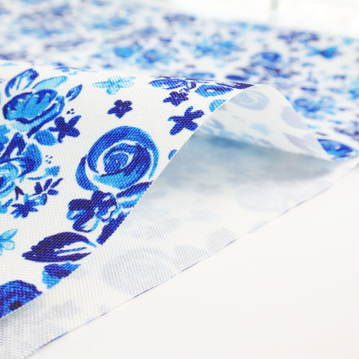 This printed WPC-Lite is of a variety of blue flowers on a white background.
