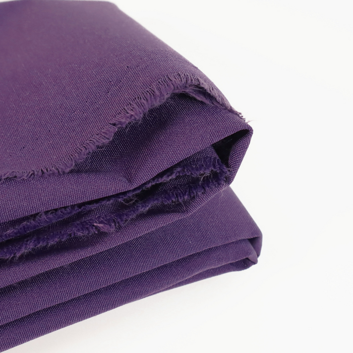 This ReNew Canvas solid is a deep and saturated shade of purple. This photo is of the fabric folded.