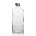 Common Good 16 ounce glass refillable laundry detergent bottle with metal screw-on lid.