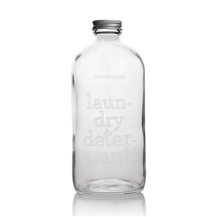 Common Good 16 ounce glass refillable laundry detergent bottle with metal screw-on lid.