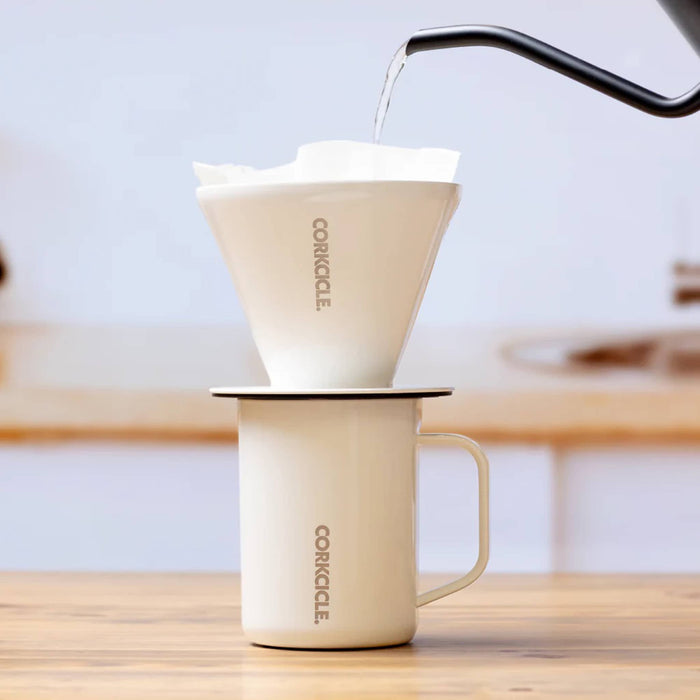 Corkcicle Pour-Over Coffee Kit in white Oat Milk finish with filter and insulated mug, shown stacked and in use.
