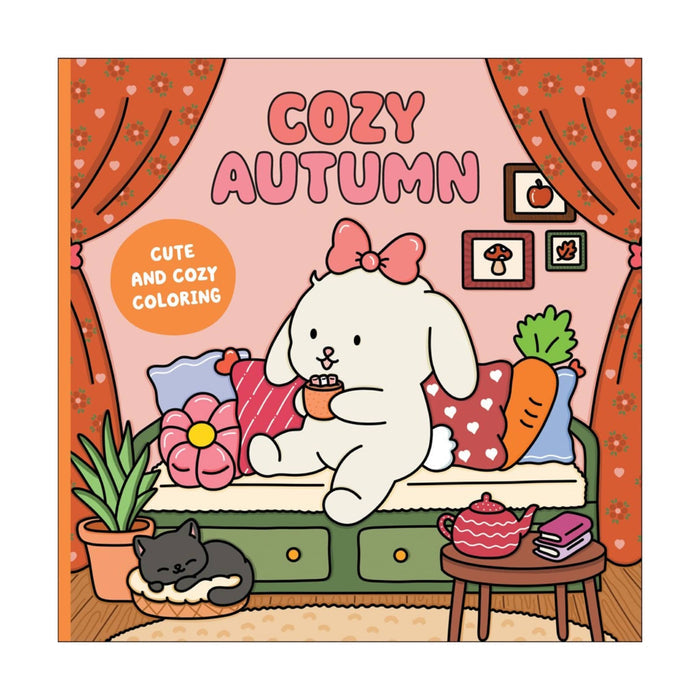 A square coloring book cover titled 'COZY AUTUMN' shows a white bunny sitting on a bed with autumn-themed cozy elements, including orange curtains, a pink wall, a carrot, a flower, a small cat, and a teapot on a side table. The text 'CUTE AND COZY COLORING' appears on the left.